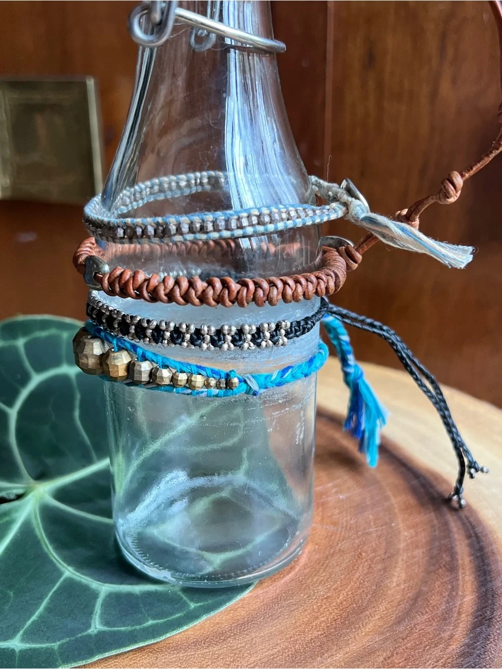 Set of Four. Stackable Beaded and Cord Bracelets - Blue, Brown, Silver, Gold